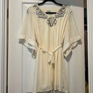 Cream bell sleeve with beaded neck detail